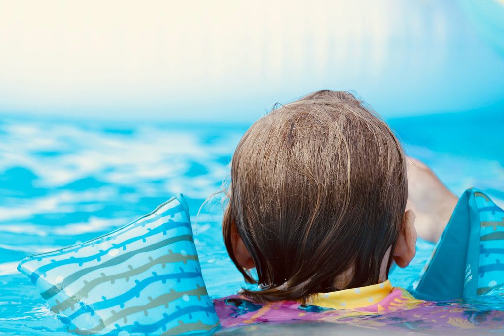 Child swimming in modular pool
