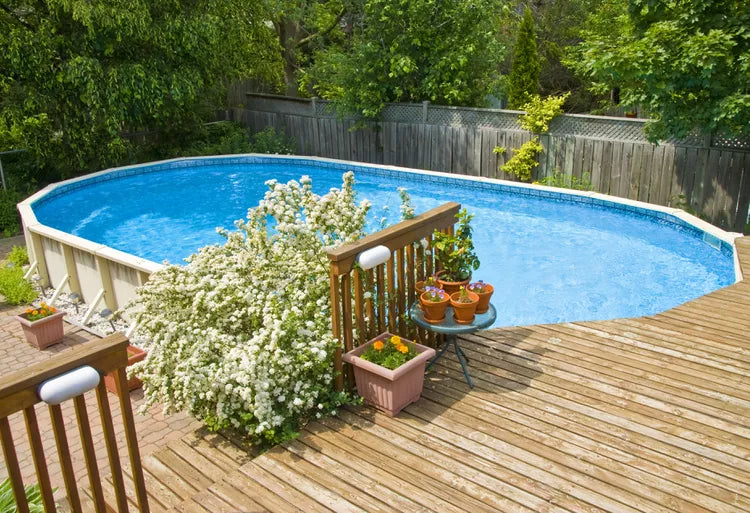 modular pool with wooden deck in the backyard